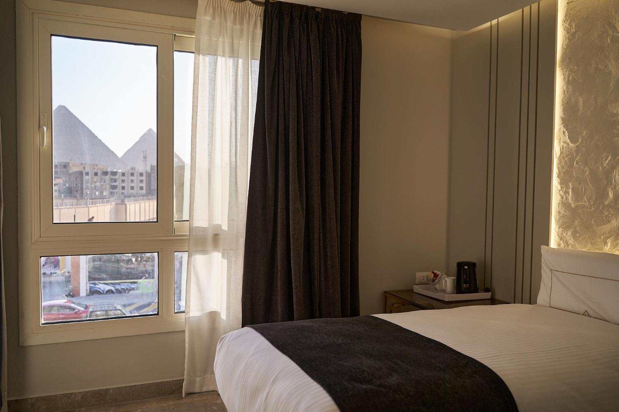 Pyramids Charm Hotel Al Kawm al Akhdar Extérieur photo